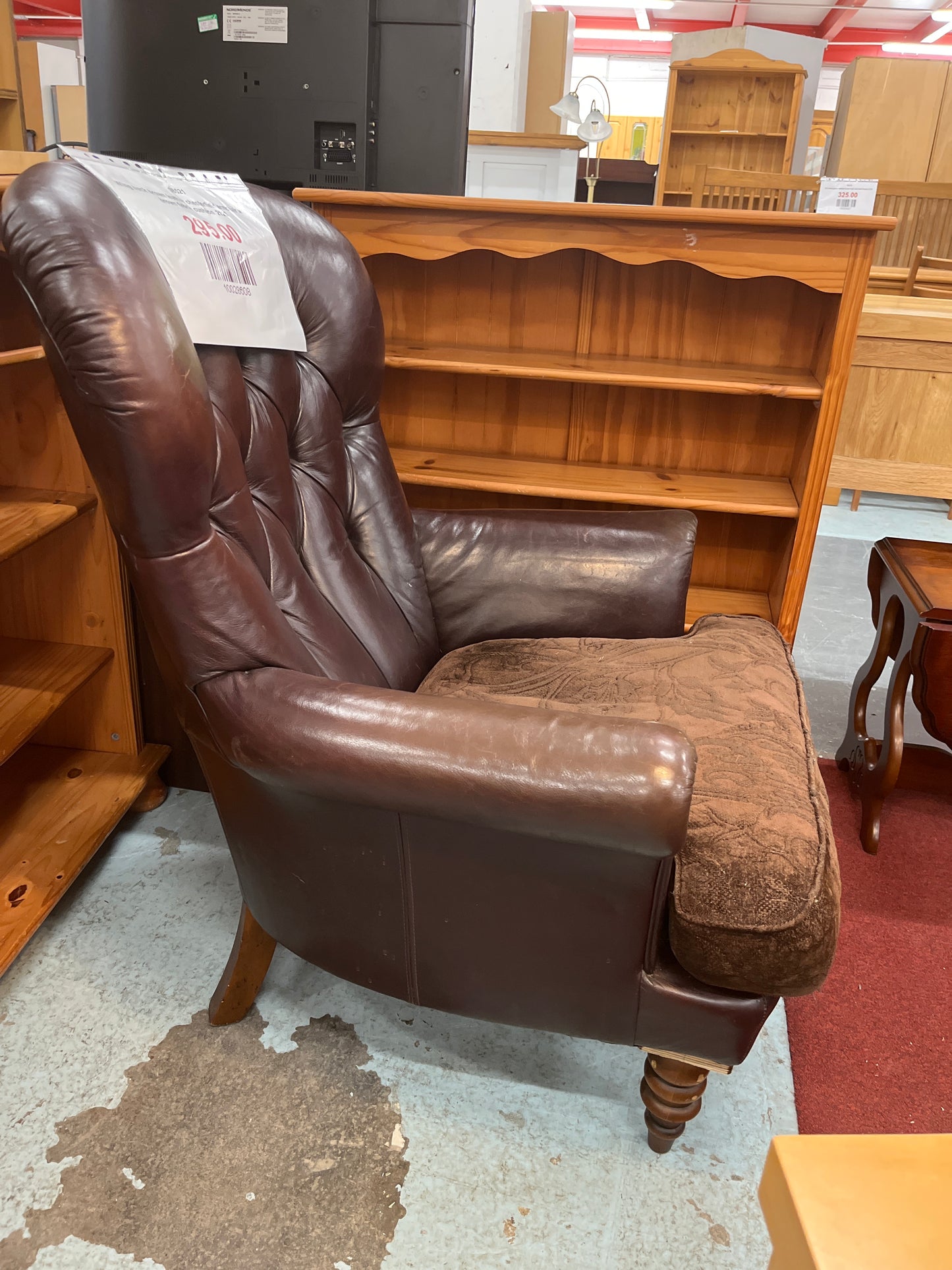 Wing back brown leather chesterfield armchair with brown fabric cushion  2125