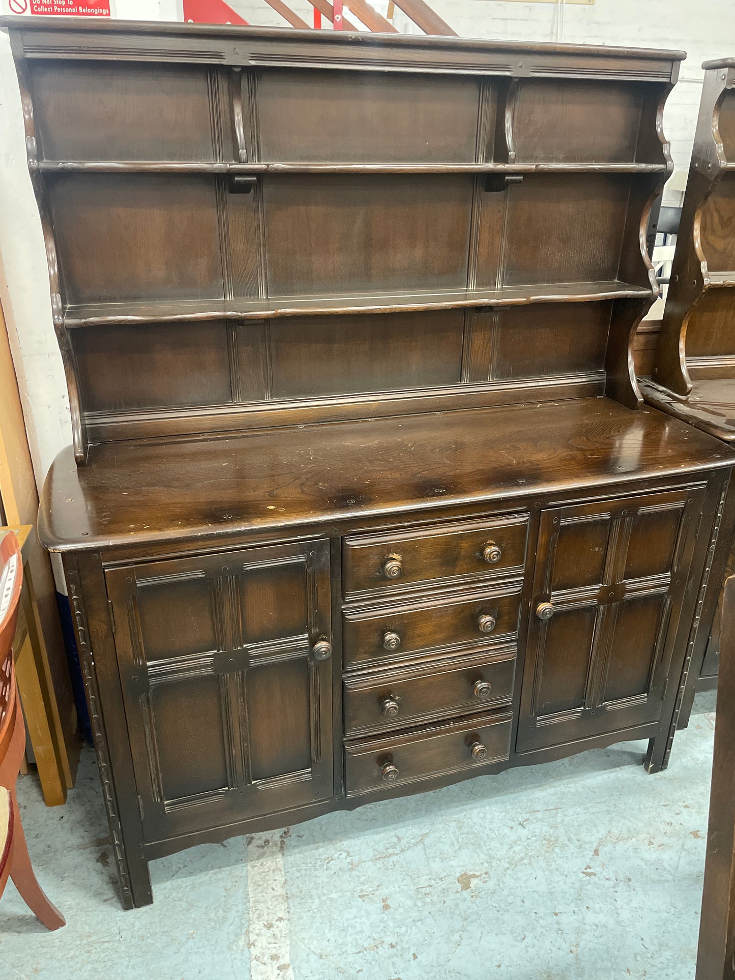 Ercol dark oak stained 4 drawer 2 door sideboard cones with open top shelf