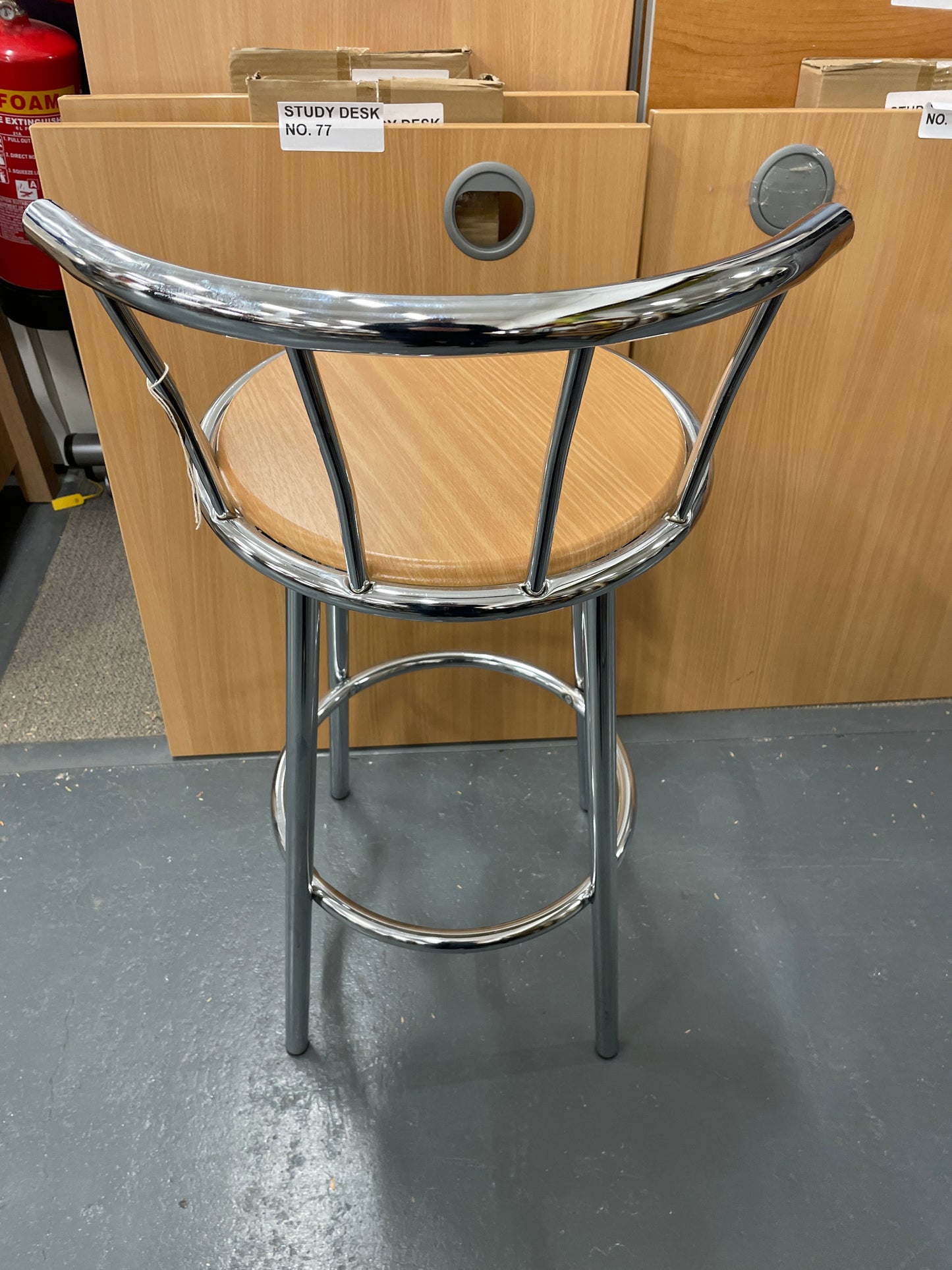 Tall chrome framed bar stool with back and beech seat