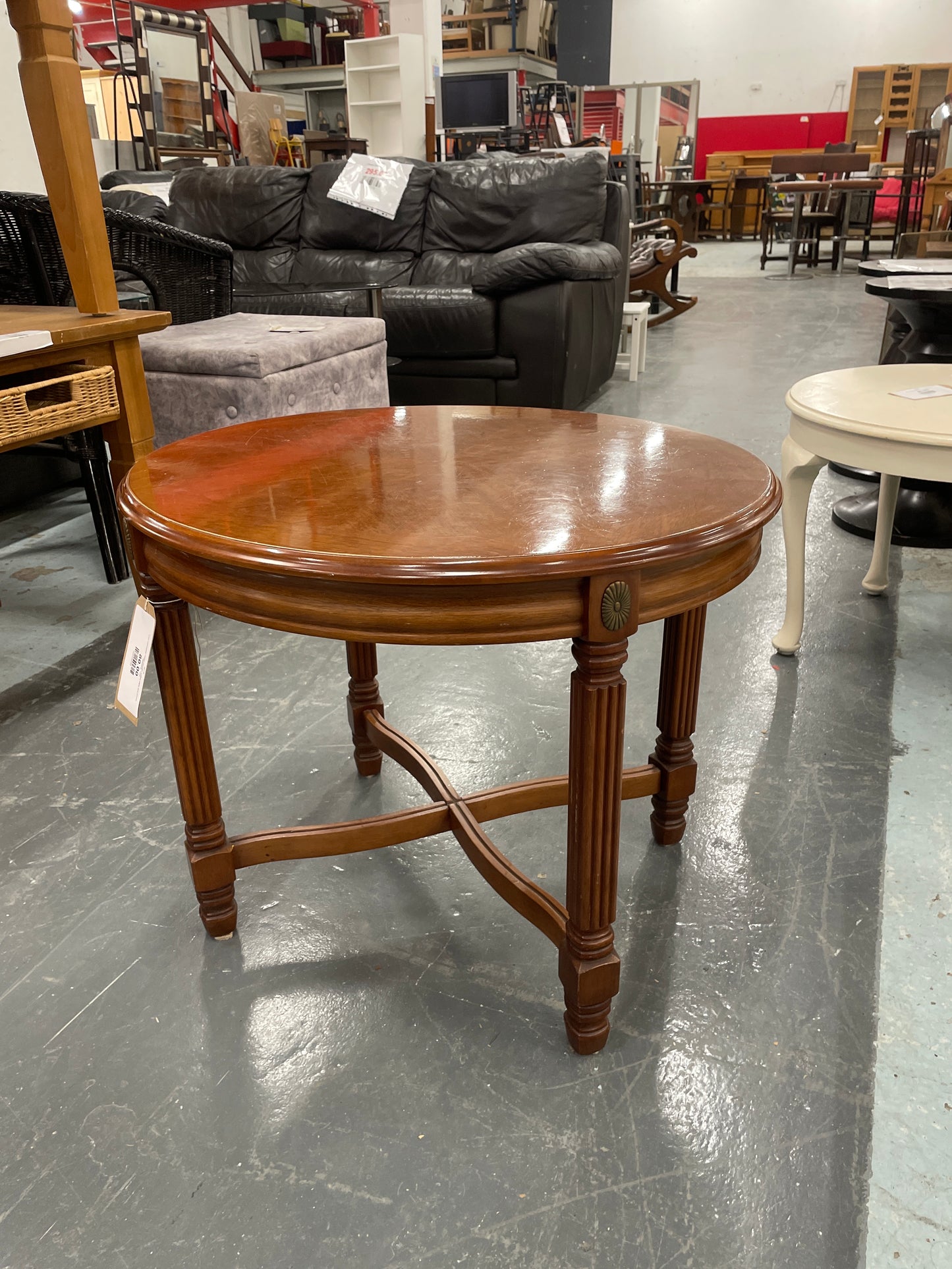 Low mahogany inalid circular coffee table and ornate detailing  1125