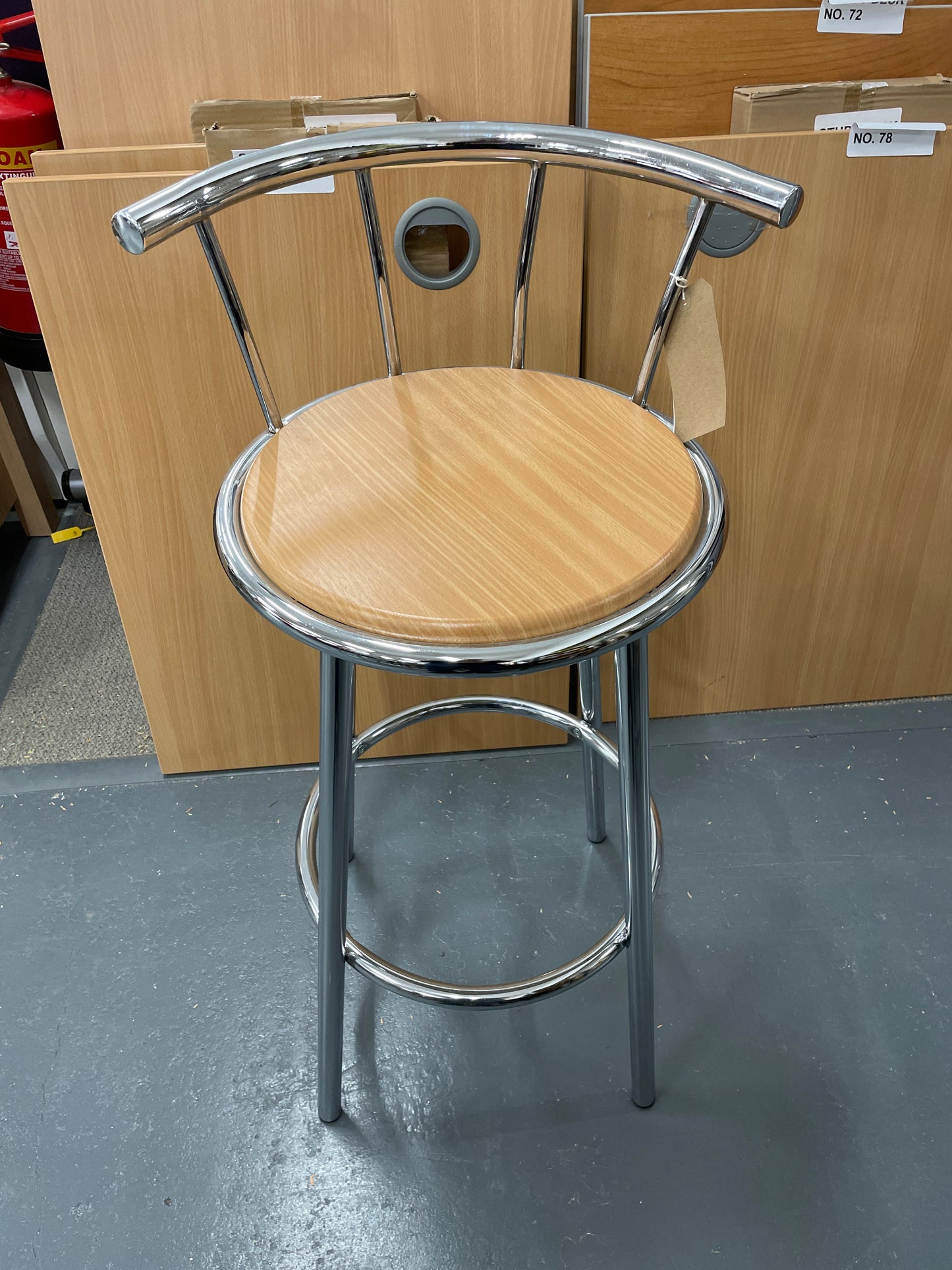 Tall chrome framed bar stool with back and beech seat