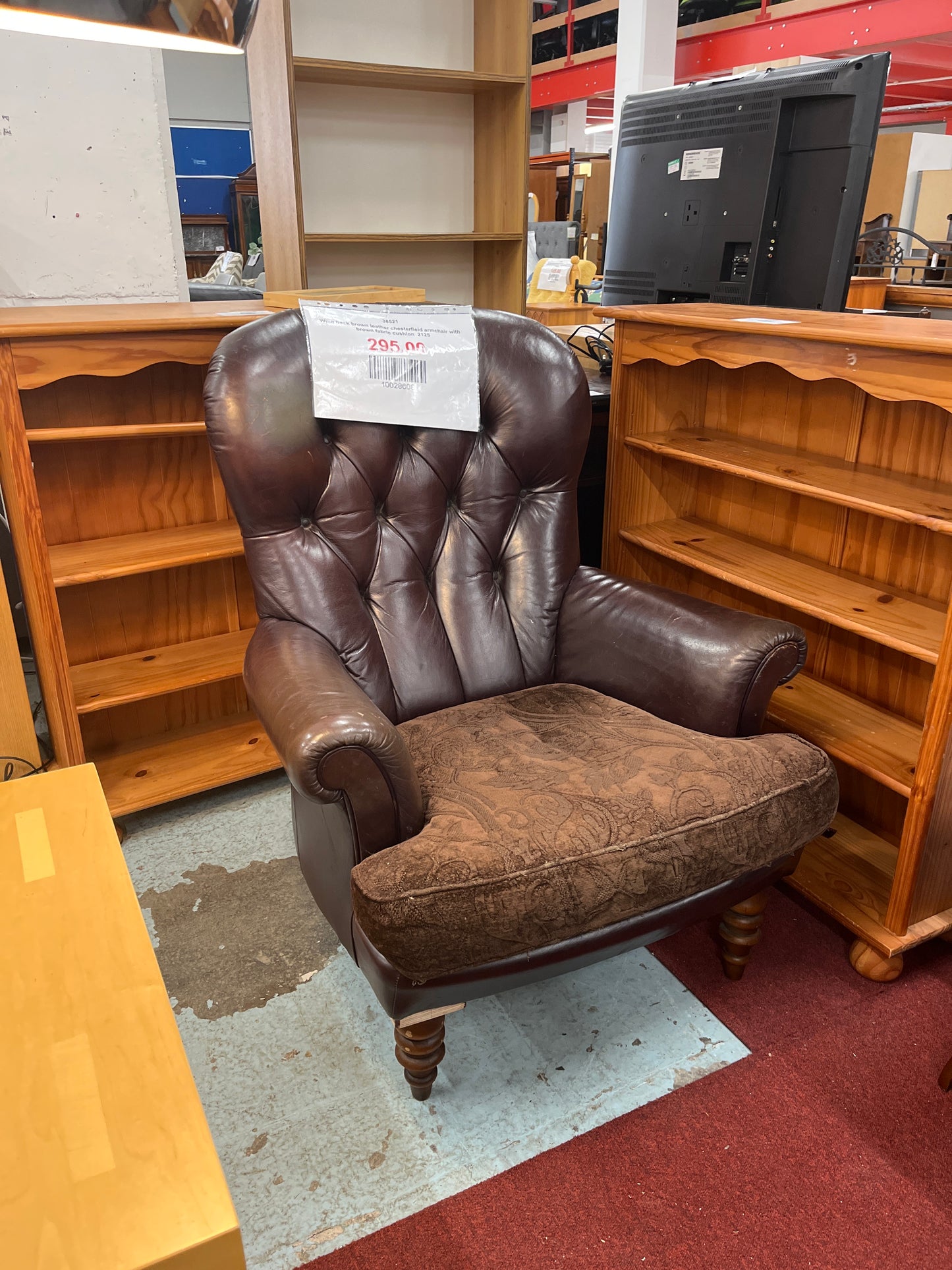 Wing back brown leather chesterfield armchair with brown fabric cushion  2125