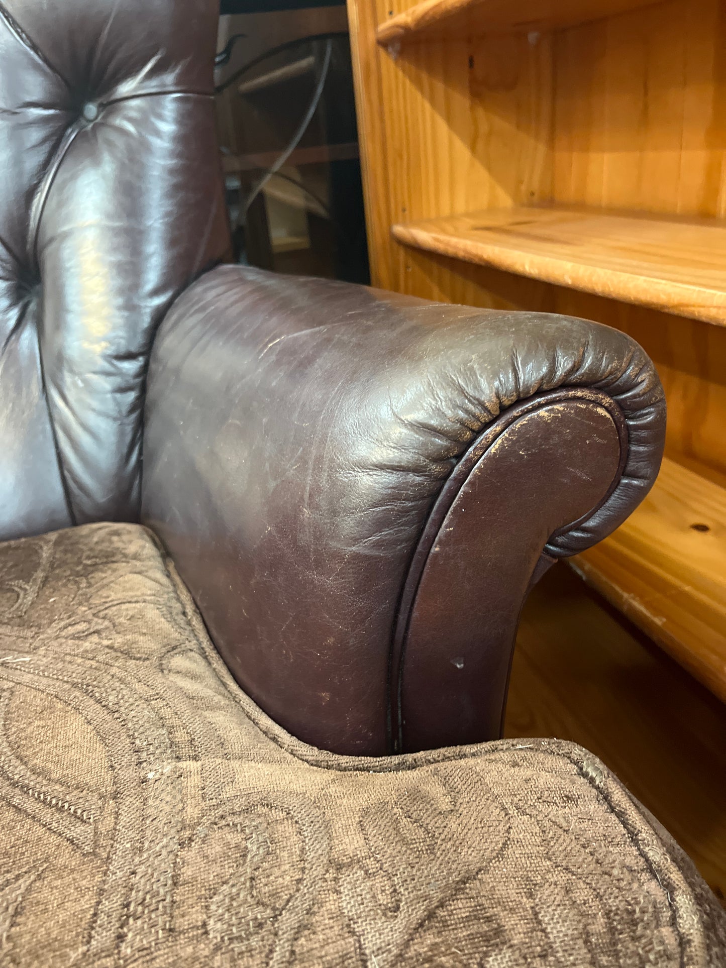 Wing back brown leather chesterfield armchair with brown fabric cushion  2125