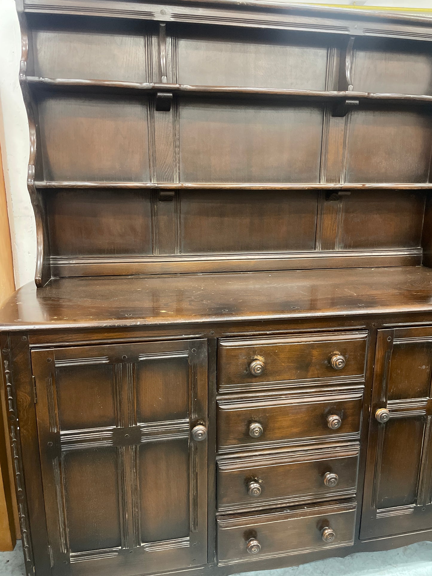 Ercol dark oak stained 4 drawer 2 door sideboard cones with open top shelf