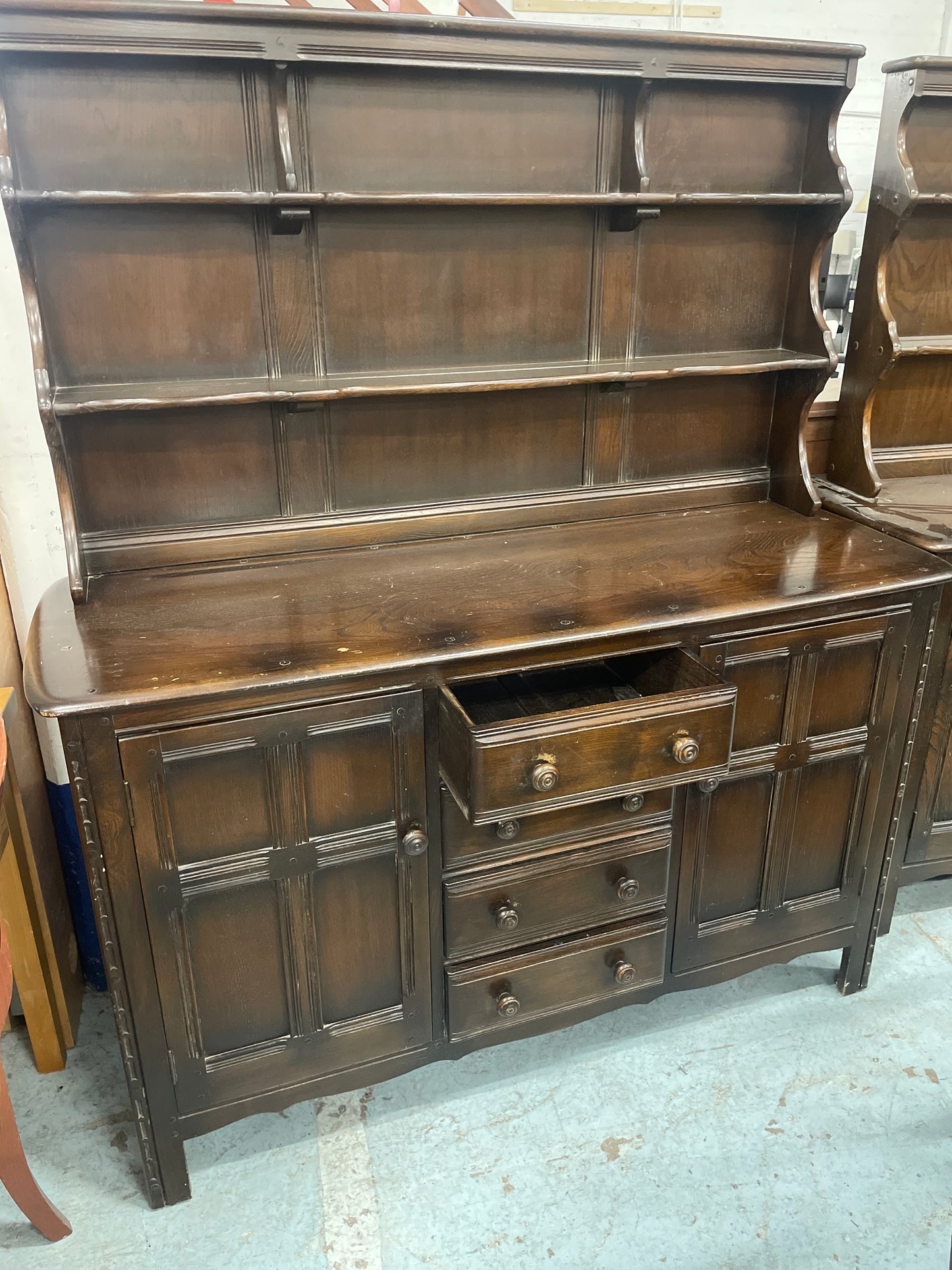 Ercol dark oak stained 4 drawer 2 door sideboard cones with open top shelf