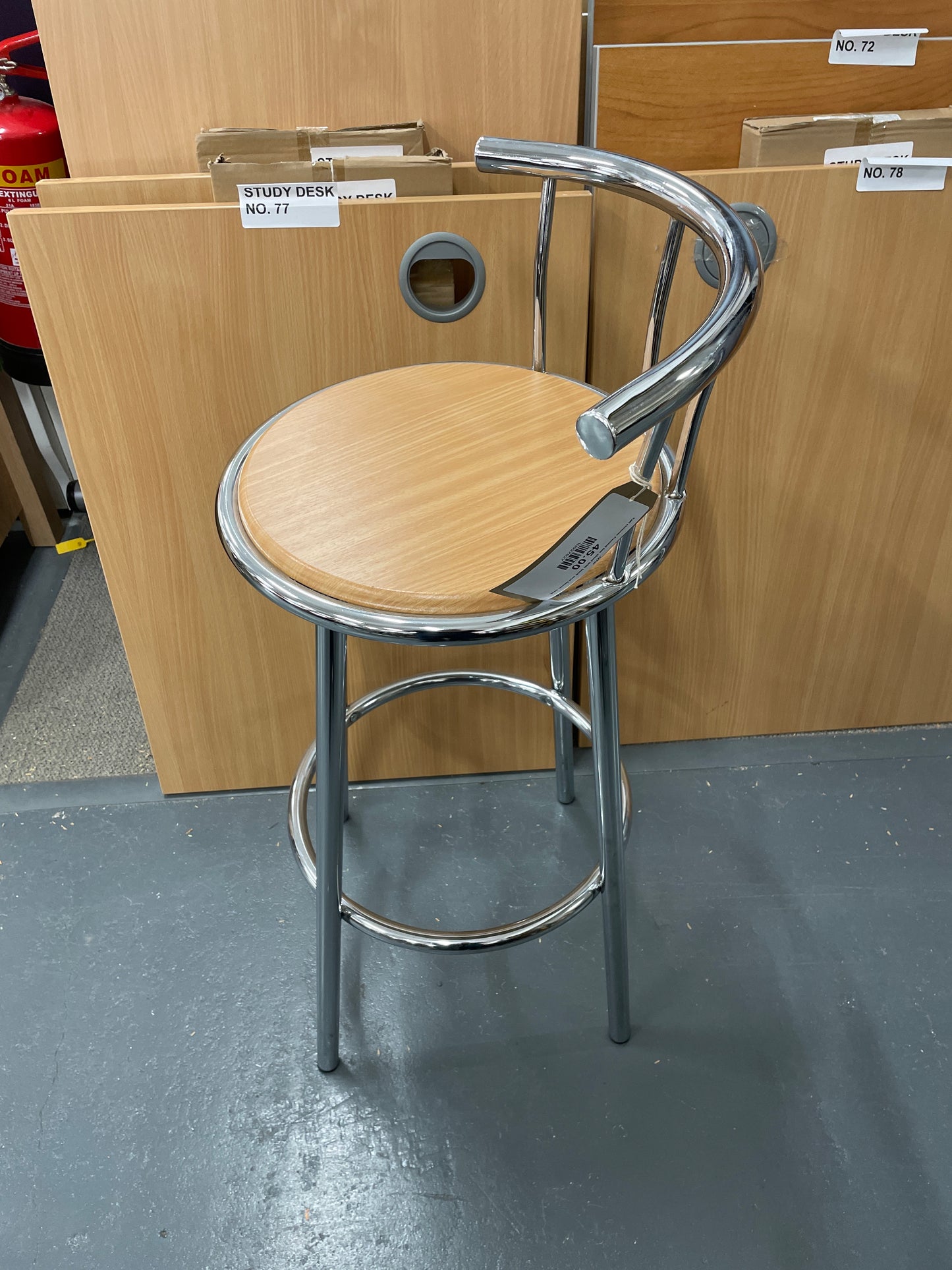 Tall chrome framed bar stool with back and beech seat