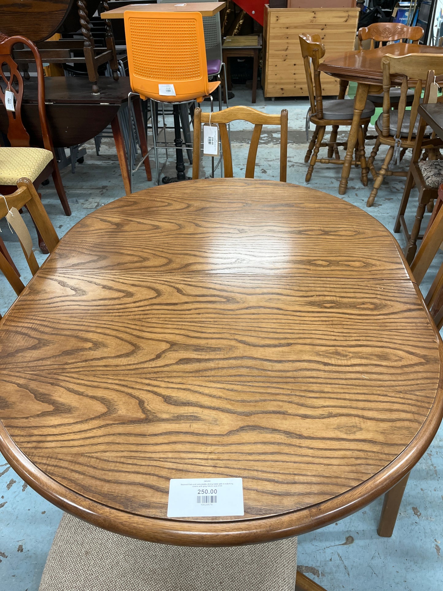 Stained Oak oval extendable dining table with 4 matching chairs with grey fabric seat 2125