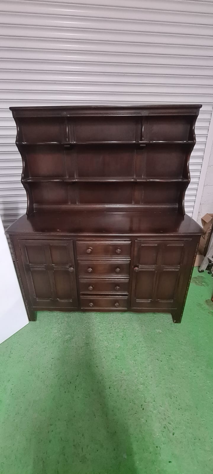 Ercol dark oak stained 4 drawer 2 door sideboard cones with open top shelf