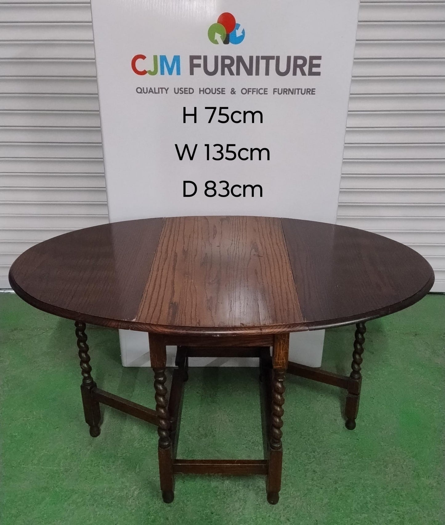 Dark wood drop leaf oval table with swirl legs 3124