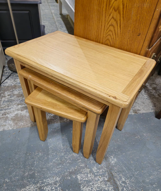 Nest of 3 oak veneer tables  2324