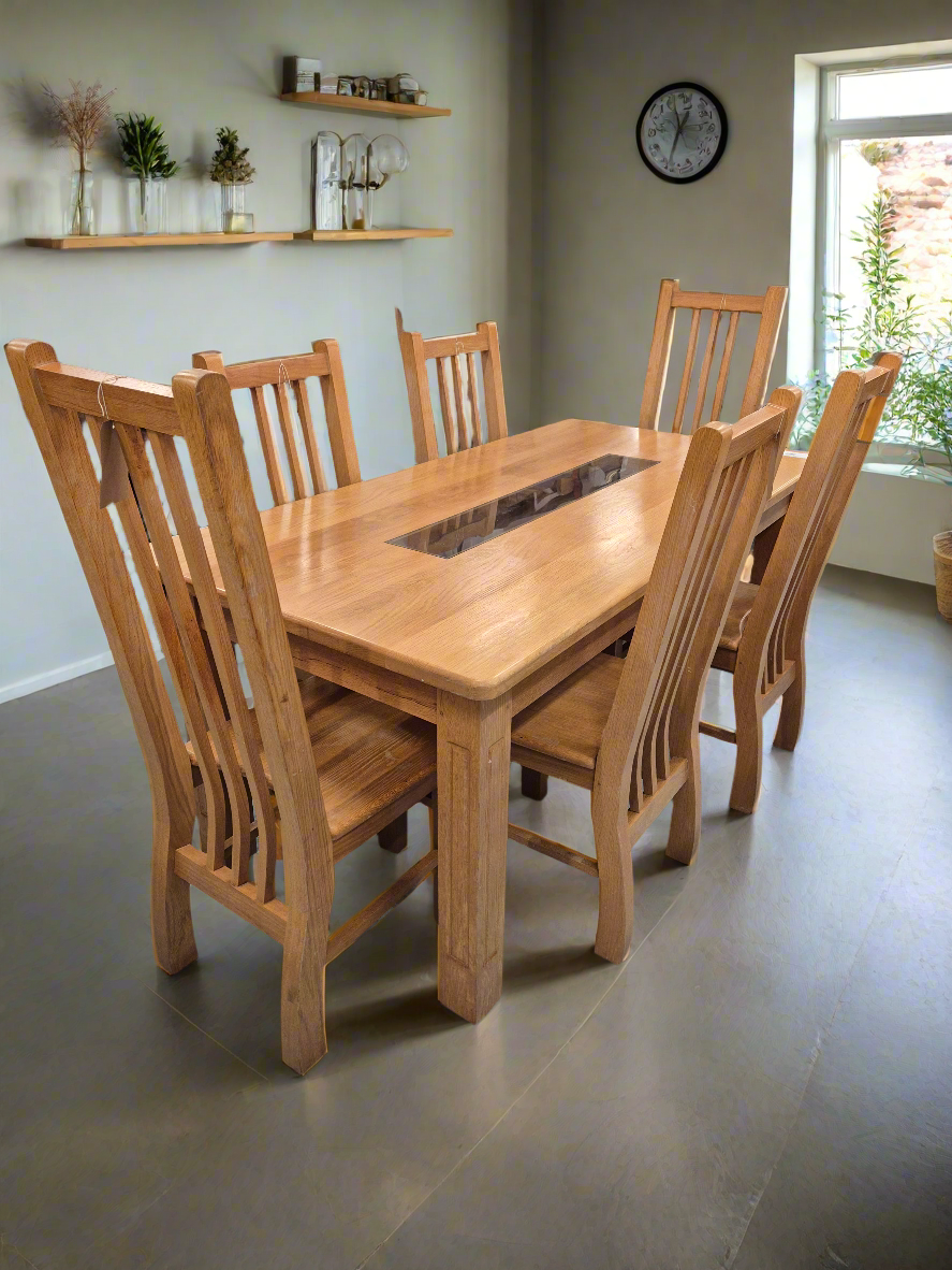 Solid oak kitchen table with central glass insert and 6 no solid wood matching chairs  1125