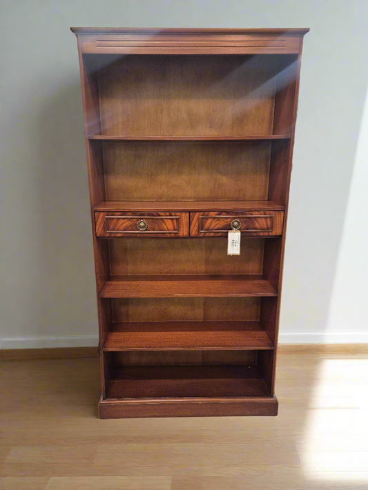 Tall Mahogany inlaid slim open bookcase with central drawers  1125