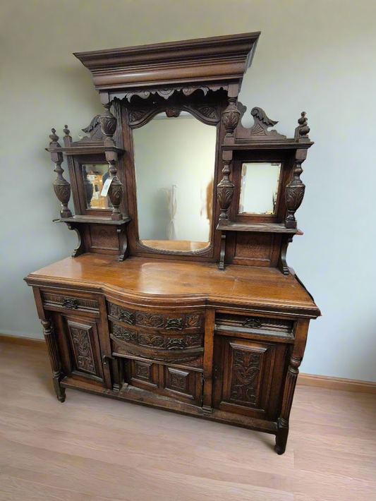 Large solid mahogany carved sideboard with back drop mirror and drawers