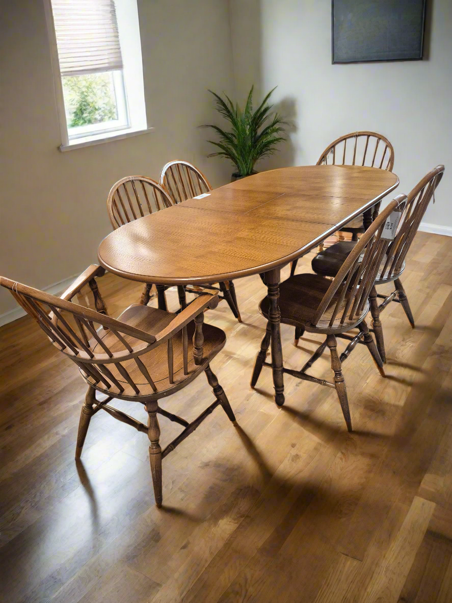 Solid oak stained extendable oval kitchen table with 4 no. matching chairs and 2 no. carvers  2125