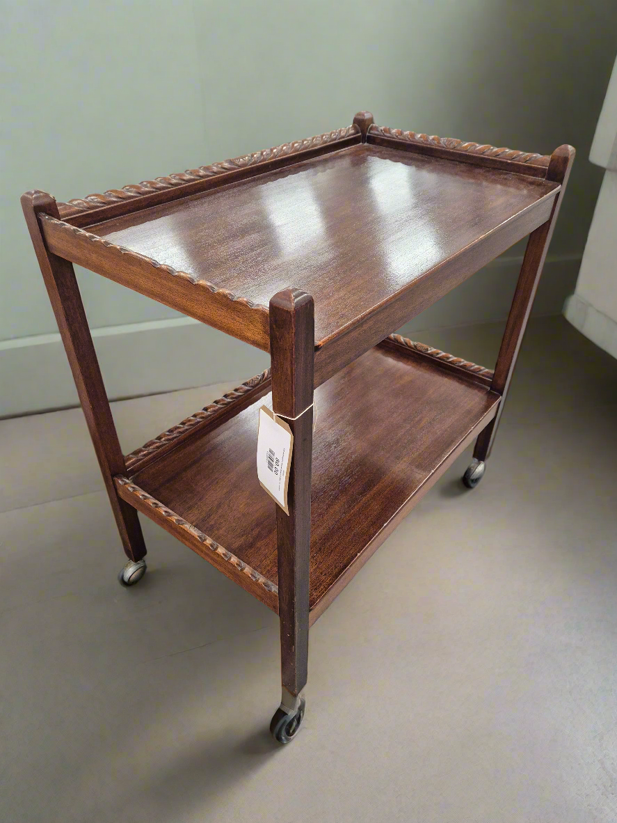 Tall mahogany tiered drinks trolley on castors 