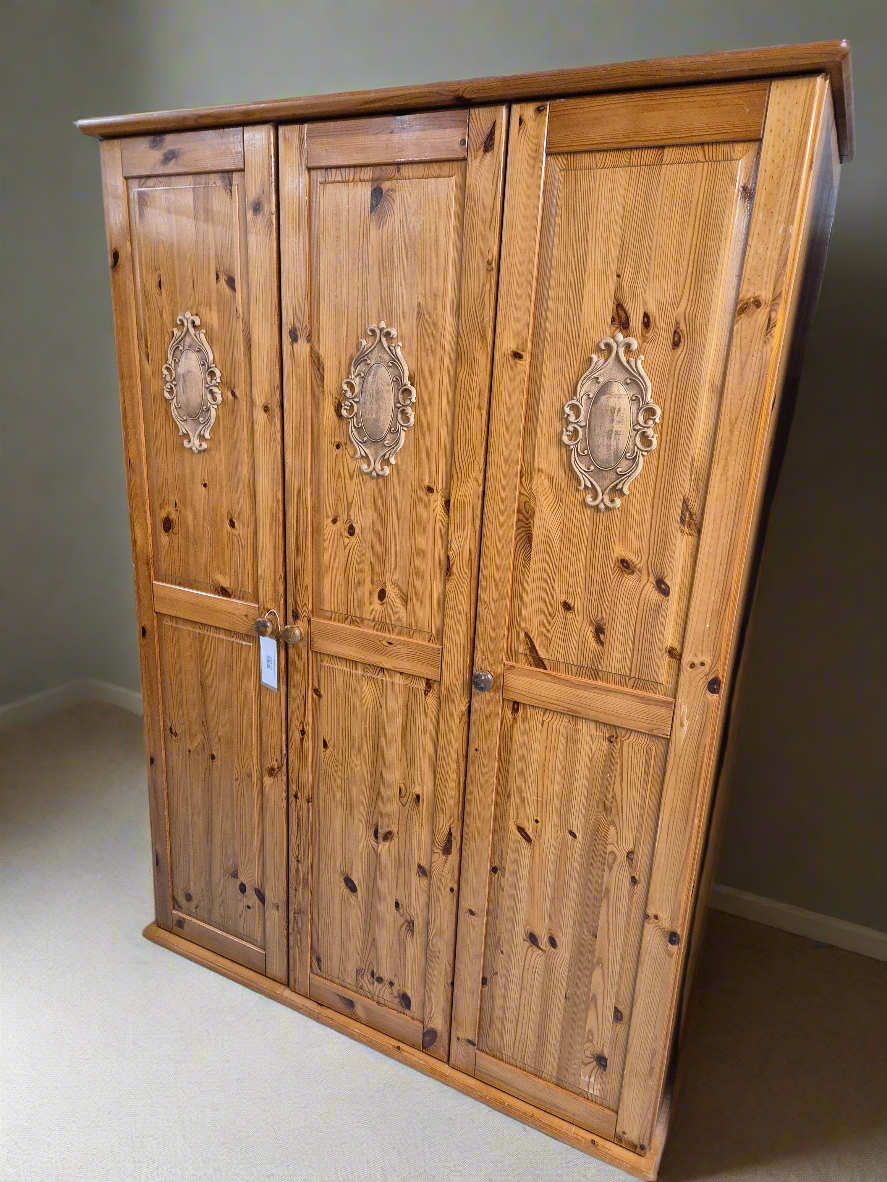 Tall 3 door solid pine wardrobe with wooden detail on door panels  4224