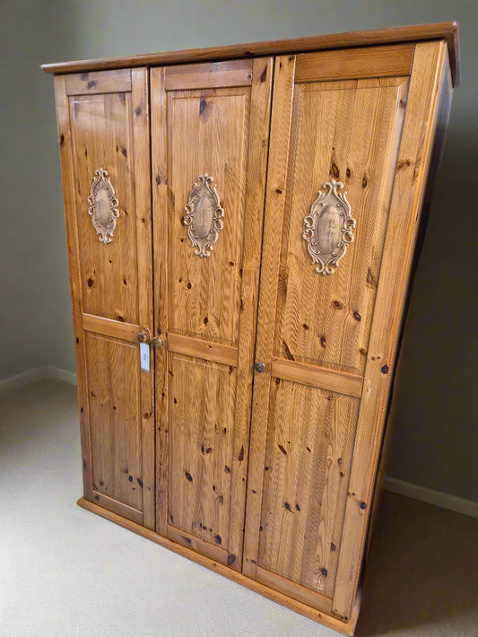 Tall 3 door solid pine wardrobe with wooden detail on door panels  4224