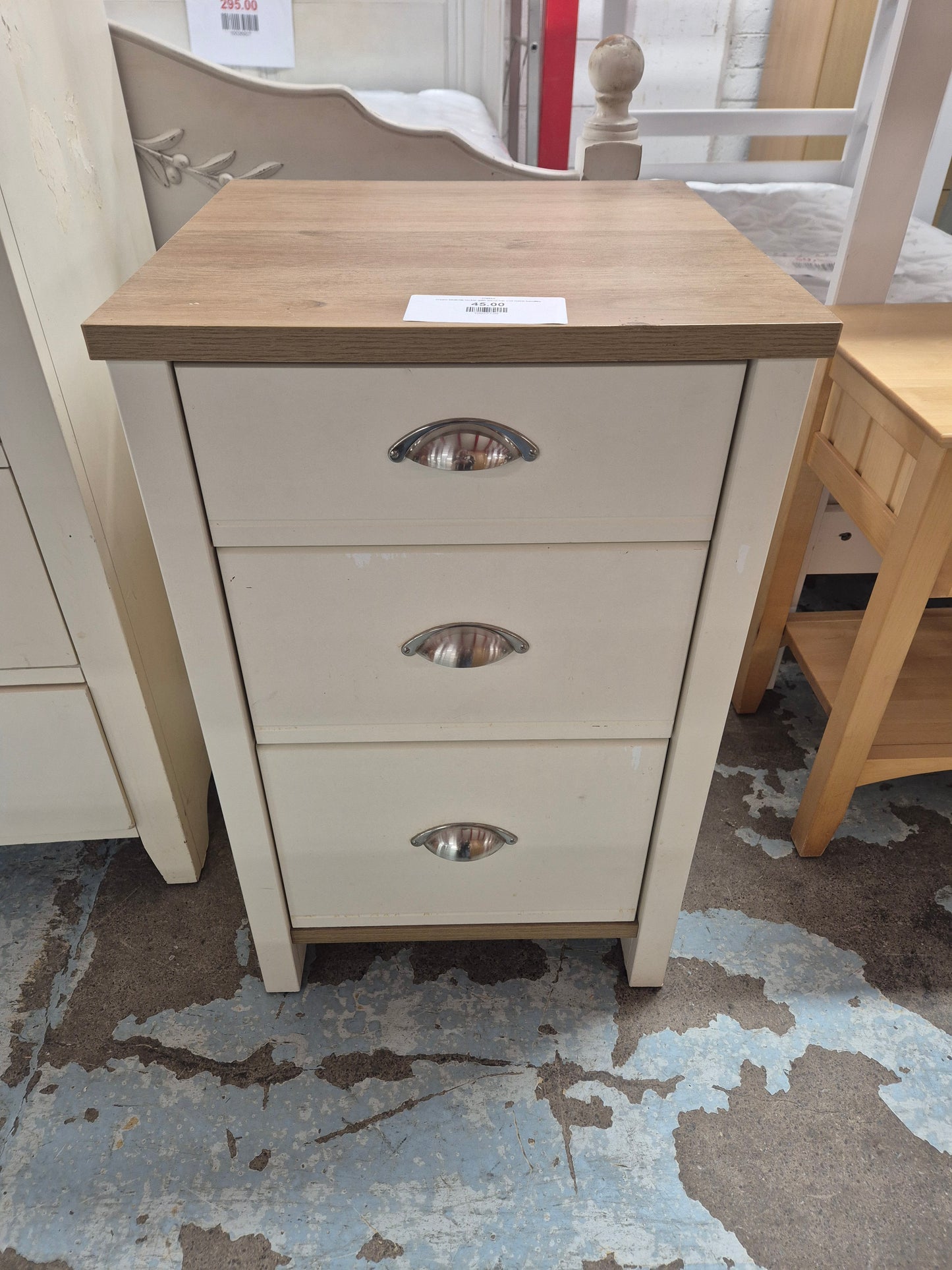 cream bedside locker with wood top and metal handles