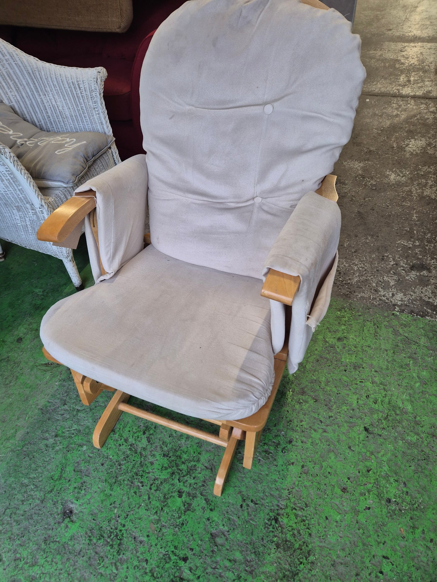 Solid wood rocking chair with matching footstool and cream fabric cushions  1125