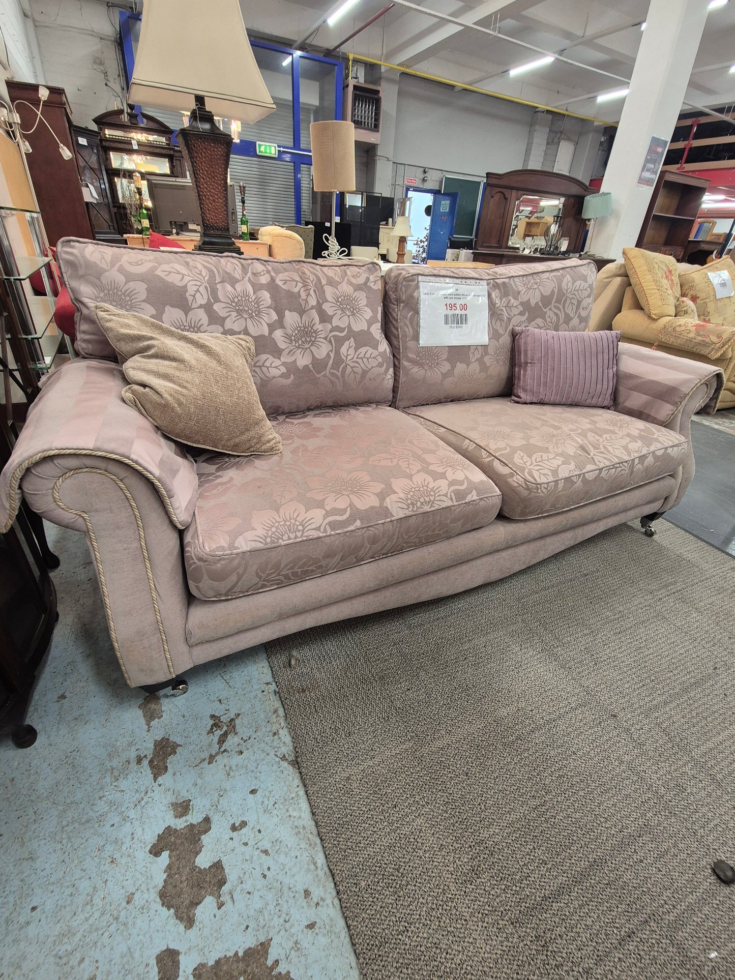 Large 2 seater brown floral pattern fabric sofa on castors with arm throws 1125