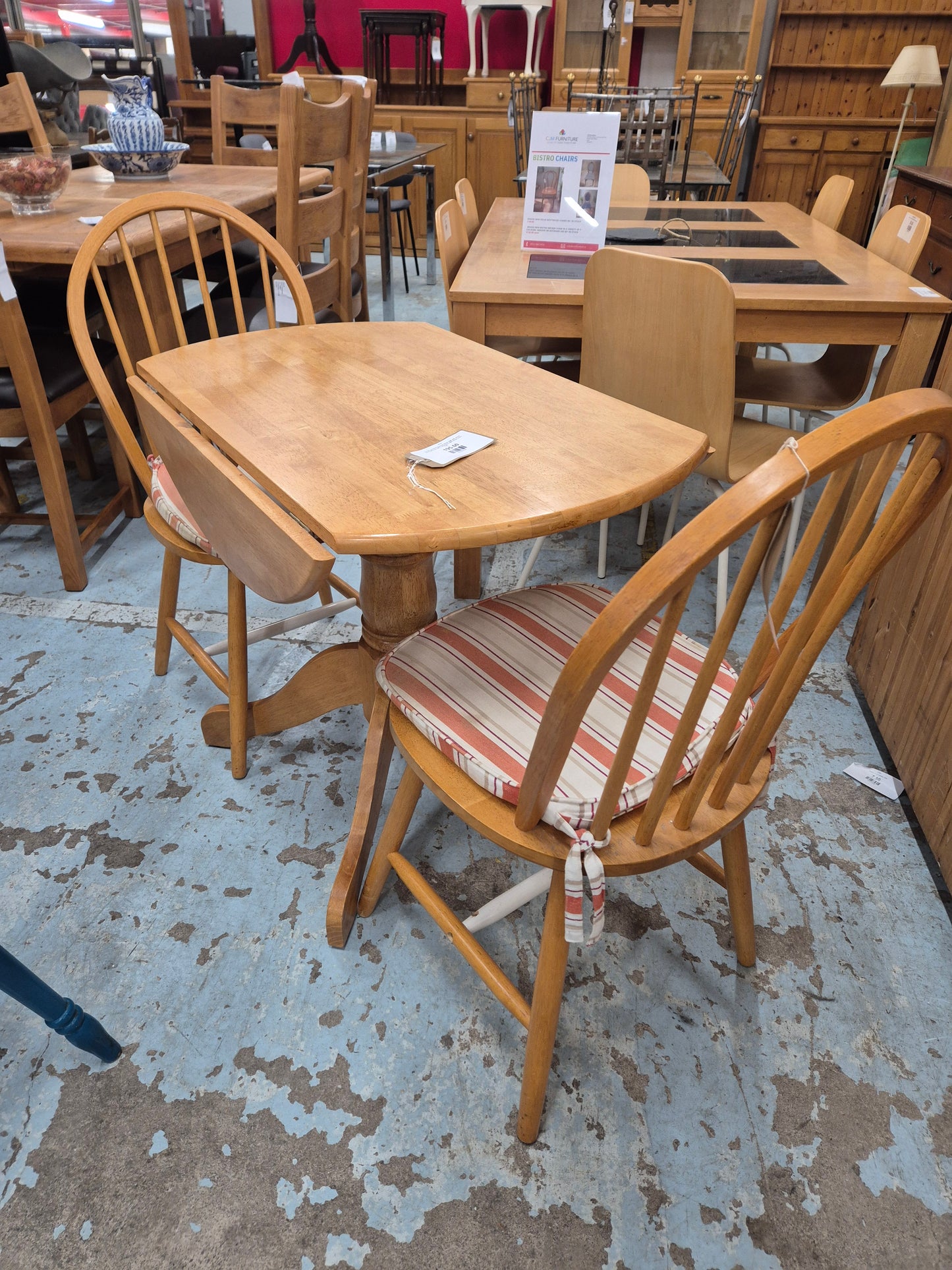 Circular hardwood drop leaf kitchen table with central base%A0comes with 2 spoonback solid kitchen chairs 1125