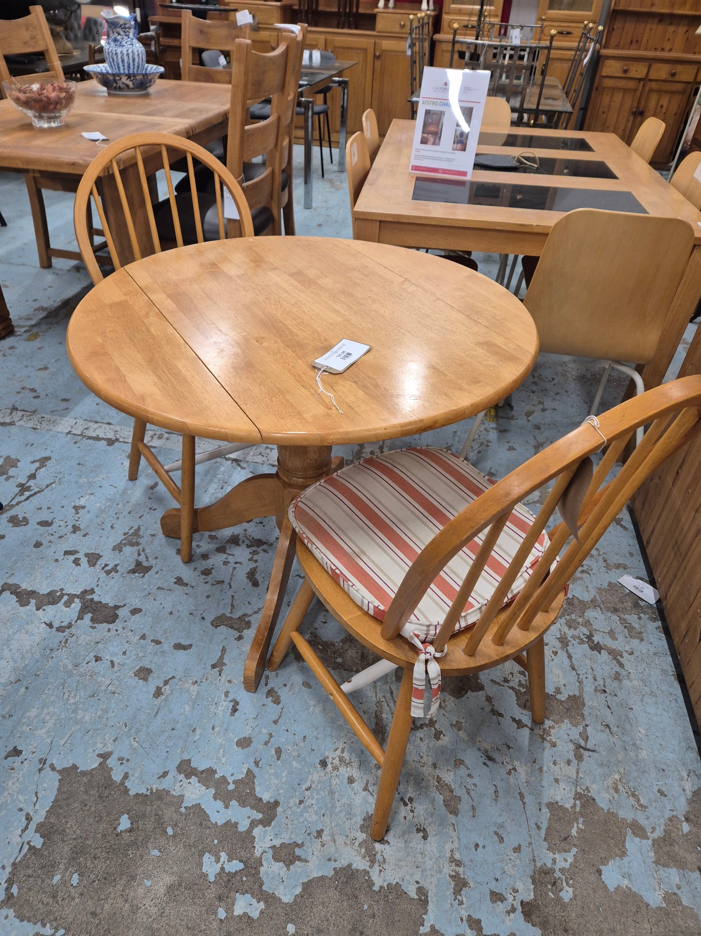 Circular hardwood drop leaf kitchen table with central base%A0comes with 2 spoonback solid kitchen chairs 1125