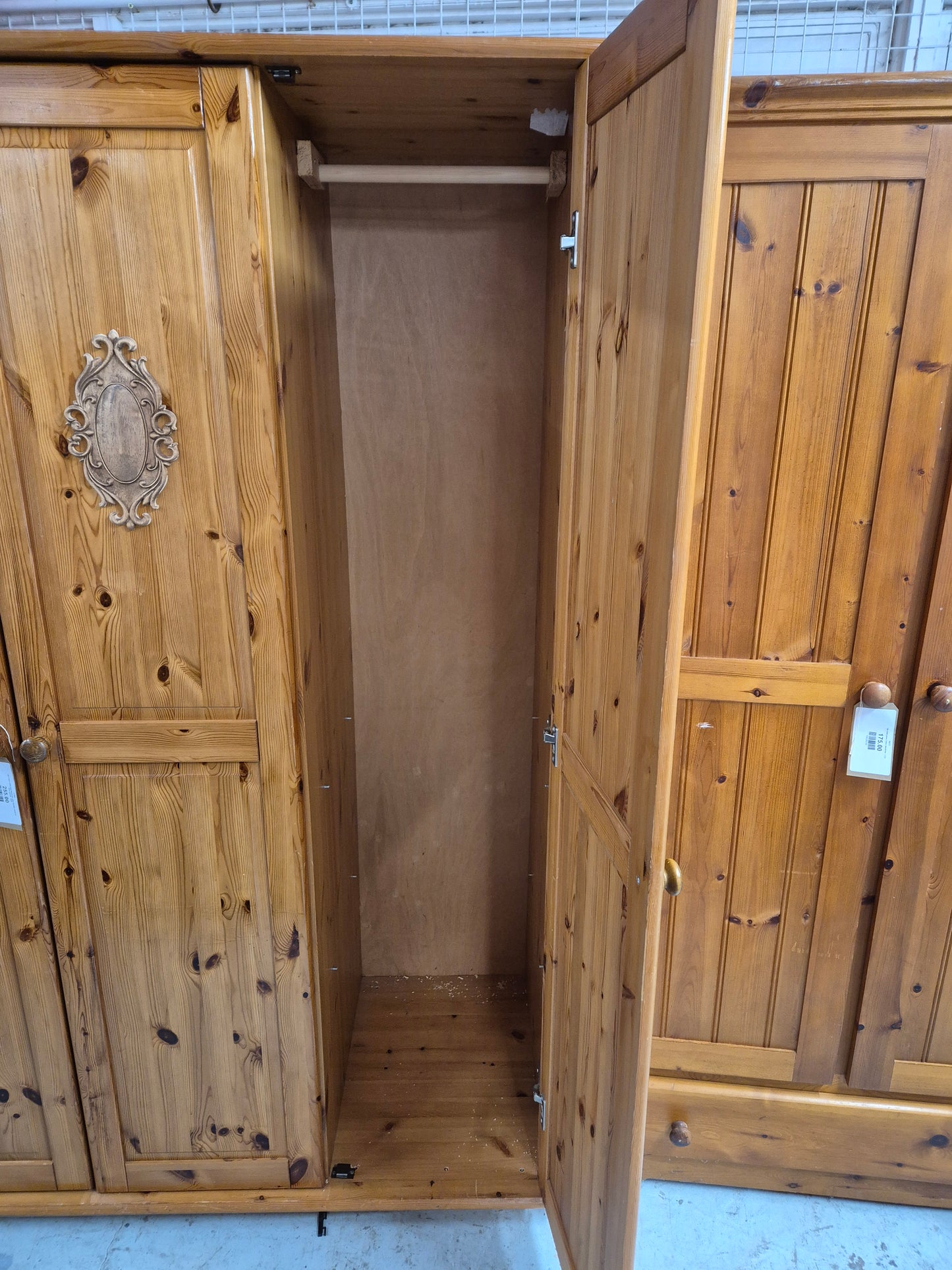 Tall 3 door solid pine wardrobe with wooden detail on door panels  4224