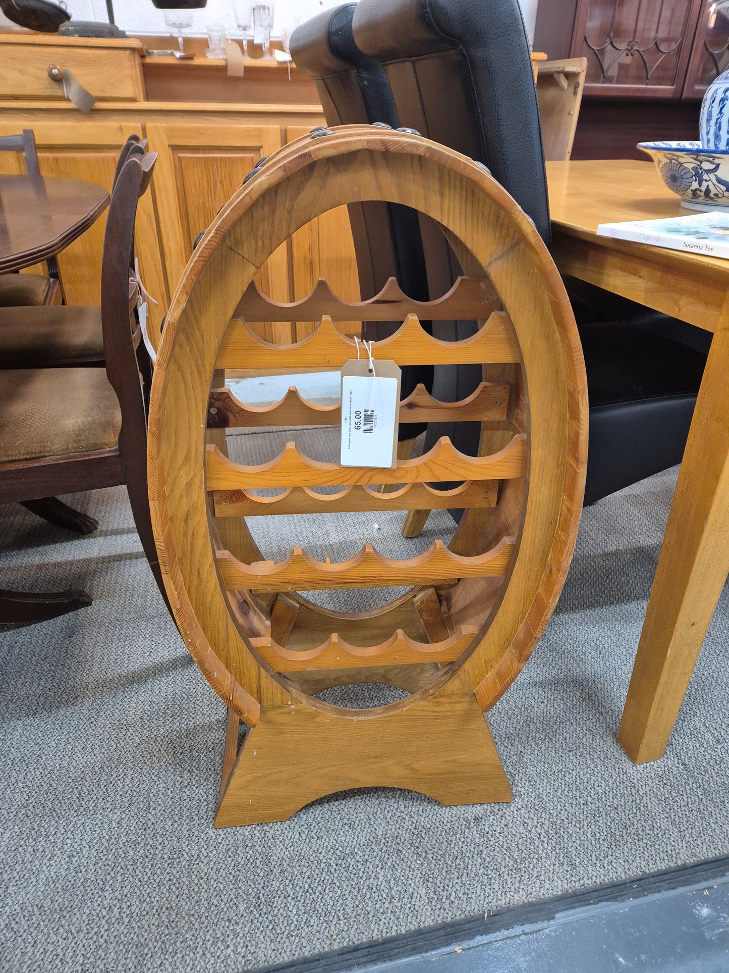 Solid pine oval wine rack with black stud detail  4224