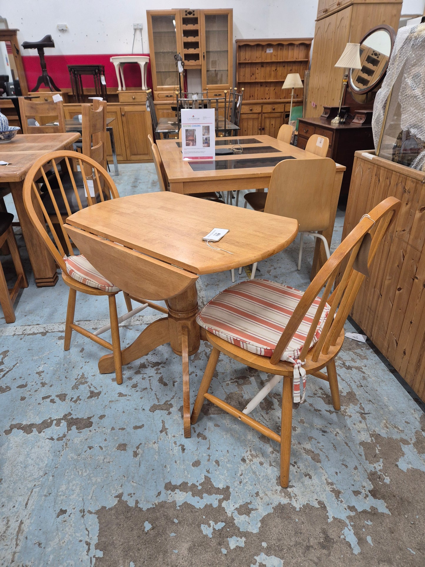 Circular hardwood drop leaf kitchen table with central base%A0comes with 2 spoonback solid kitchen chairs 1125