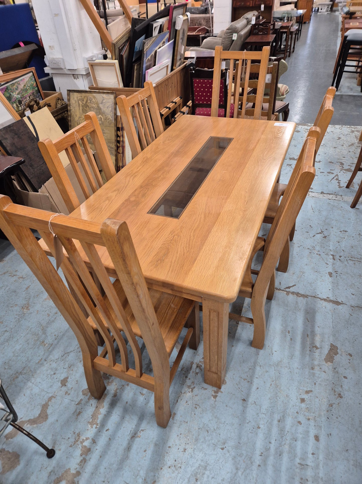 Solid oak kitchen table with central glass insert and 6 no solid wood matching chairs  1125